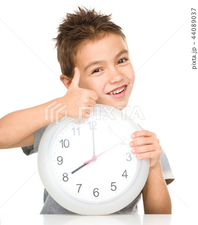 Boy is holding big clock 44089037