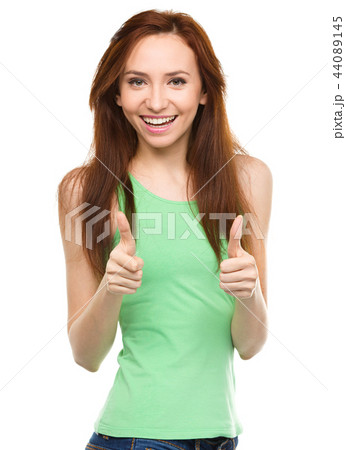 Woman is showing thumb up gesture Woman is showing thumb up gesture 44089145