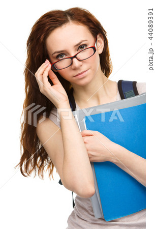 Young student girl is holding book Young student girl is holding book 44089391