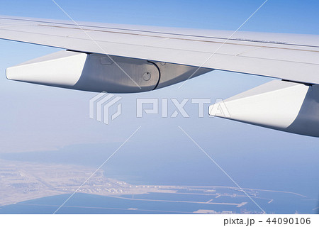A view from a window in an airplane, wing of an airplane. 44090106