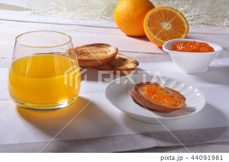 Morning Breakfast with orange jam on bread toast 44091981