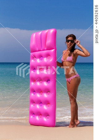Young slim brunette woman suntan Young slim brunette woman suntan 44092636