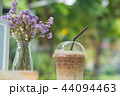 Ice coffee in clear plastic with dry flowers 44094463