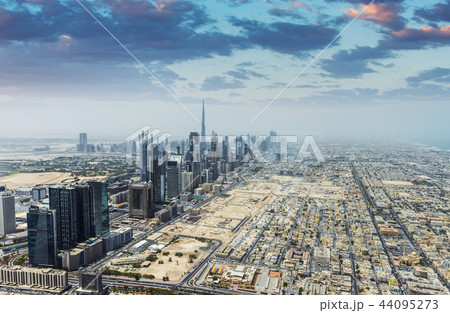 Aerial view of modern skyscrapers and sea in the background in Dubai, UAE. 44095273