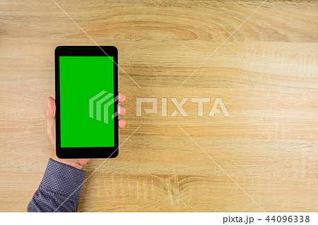Businessman holding tablet with green screen. Businessman holding tablet with green screen. 44096338