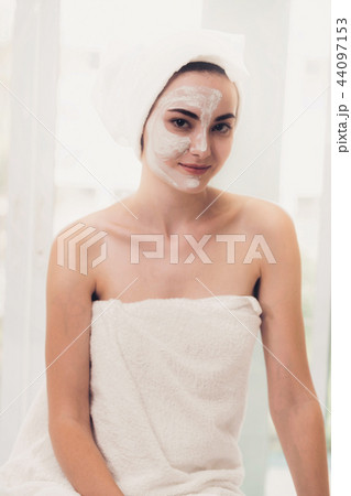 Beautiful woman having a facial treatment at spa. 44097153