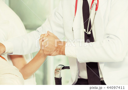 Male Doctor and Female Patient in Hospital Office Male Doctor and Female Patient in Hospital Office 44097411