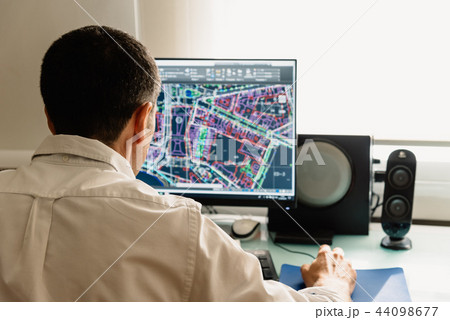 Architect drawing with cad software designing building 44098677