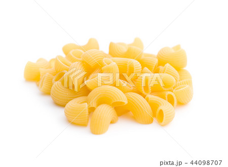 Uncooked elbow macaroni. 44098707