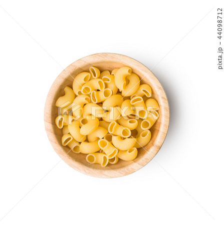 Uncooked elbow macaroni. Uncooked elbow macaroni. 44098712