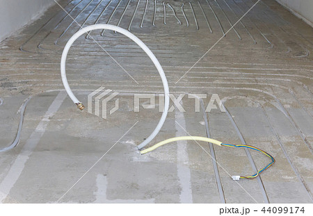New electricity and gas pipe in a concrete floor 44099174