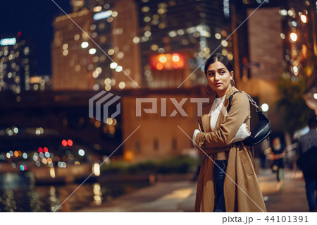 woman walking near Chicago river 44101391