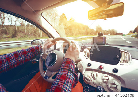 roadtrip - mans hands on the whee 44102409