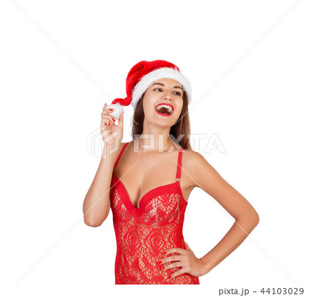 Pretty woman in christmas hat, isolated 44103029