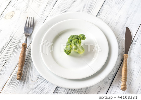 Fresh broccoli on the white plate 44108331