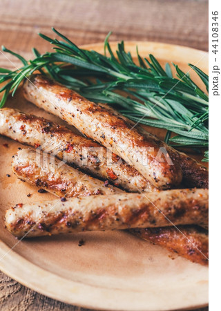 Grilled sausages with rosemary 44108346