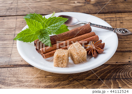 Mint and brown sugar, cinnamon in a plate Mint and brown sugar, cinnamon in a plate 44112524
