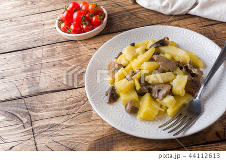 Fried potatoes with mushrooms and onions. 44112613