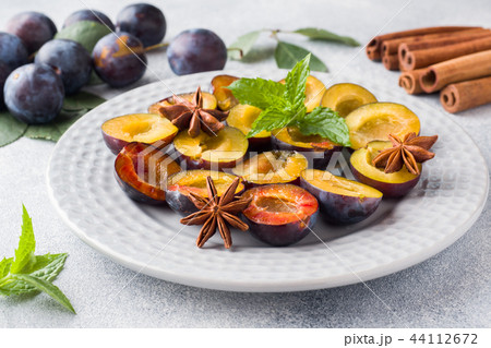 Fresh berries plums in the context of cooking  44112672