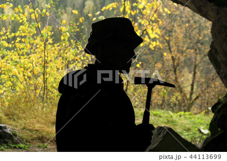 silhouette of a geologist in a cave silhouette of a geologist in a cave 44113699