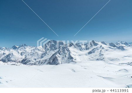 Winter snow covered mountain peaks in Caucasus. Great place for winter sports 44113991