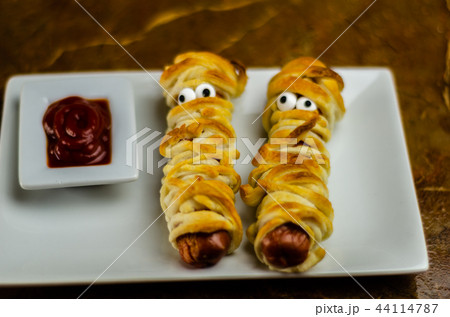 Sausage mummies in dough scary halloween food Sausage mummies in dough scary halloween food 44114787