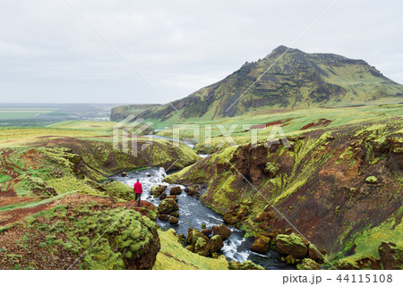 Tourist on a hike in Iceland near the Skoga River Tourist on a hike in Iceland near the Skoga River 44115108