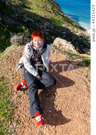 Happy smiling redhead women on Gozo, Malta. 44115425