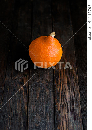 Orange pumpkins on dark wooden background 44115703