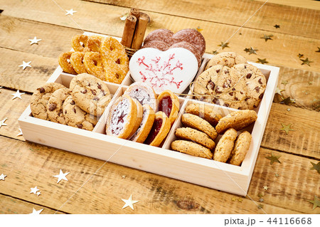 Christmas Eve cookies in a box on an old wooden table Christmas Eve cookies in a box on an old wooden table 44116668