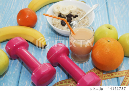 The concept of a healthy diet. Small dumbbells,  44121787