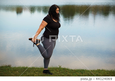 Woman stretching legs getting ready for running 44124069
