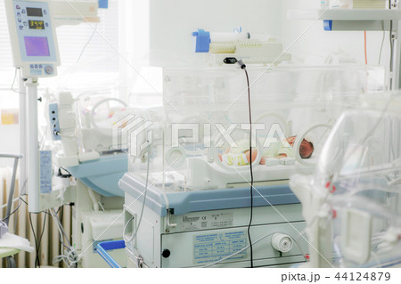 Newborn baby in hospital incubator Newborn baby in hospital incubator 44124879