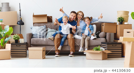 happy family mother father and children move to new apartment an 44130630