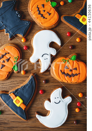 festive cookies for halloween with pumpkins on table festive cookies for halloween with pumpkins on table 44130636