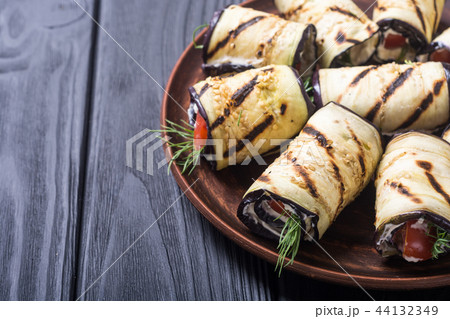 Grilled eggplant aubergine rolls with cream cheese 44132349