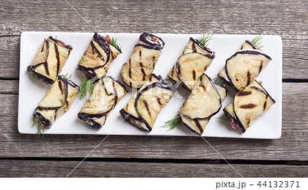 Grilled eggplant aubergine rolls with cream cheese Grilled eggplant aubergine rolls with cream cheese 44132371