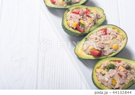 Avocado stuffed with salad 44132844