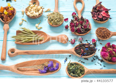 different kinds of tea in wooden spoons 44133577