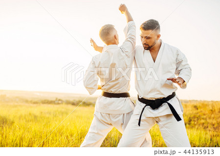 Two karate fighters, training fight in actionの写真素材 [44135913