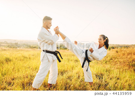 Female karate on training with male instructor Female karate on training with male instructor 44135959