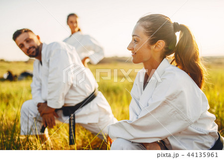 Two female karate with male instructor on training Two female karate with male instructor on training 44135961