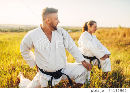 Two female karate with male instructor on training 44135962