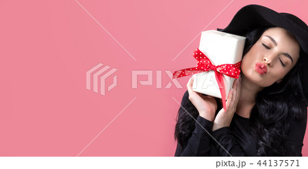 Young woman with a gift box 44137571
