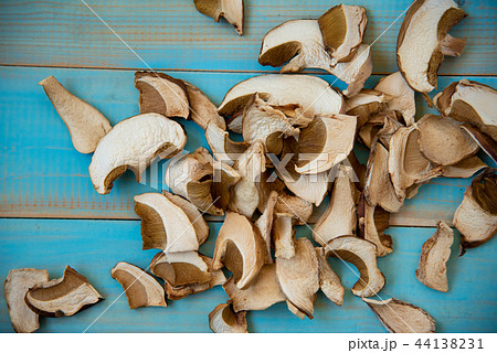 Dried porcini mushrooms on blue wooden background 44138231