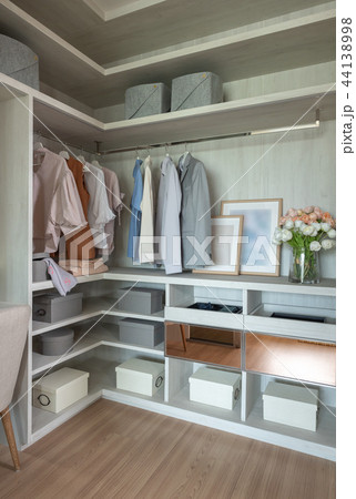 wooden wardrobe with set of clothes 44138998