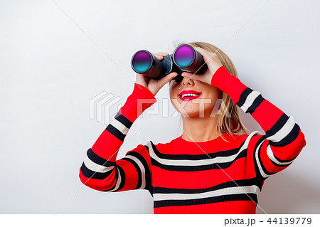 woman with binocular on white background woman with binocular on white background 44139779