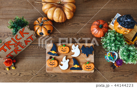 festive cookies for halloween with pumpkins on table festive cookies for halloween with pumpkins on table 44144223