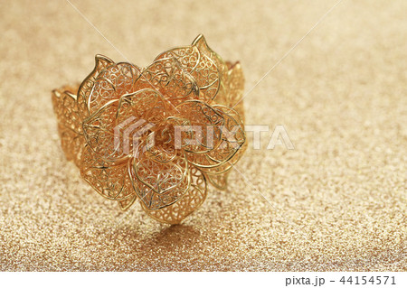 gold rose flower ring on glitter background 44154571