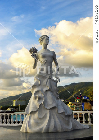 Sculpture of bride girl in dress with bouquet of b 44155165